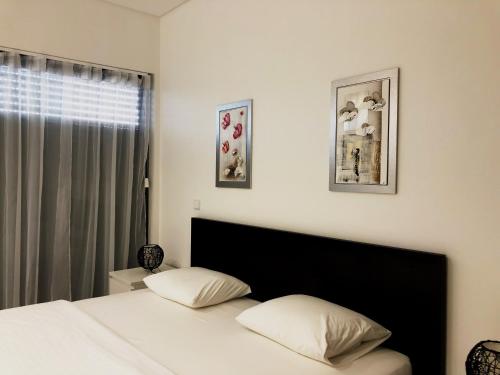 En eller flere senge i et værelse på Cavalo Preto Luxury Beach Resort - C201