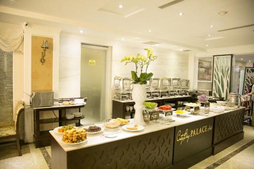 a buffet in a restaurant with food on a table at CityBay Palace Hạ Long Hotel in Ha Long