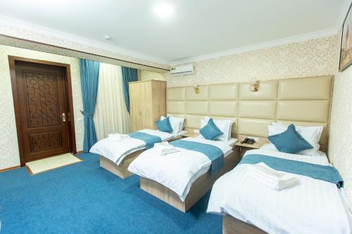 Ένα ή περισσότερα κρεβάτια σε δωμάτιο στο Mirzo Boutique Hotel