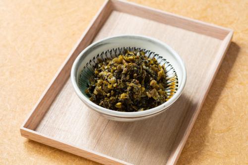 a bowl of food sitting on a plate at Vessel Hotel Kumamoto Airport in Ozu