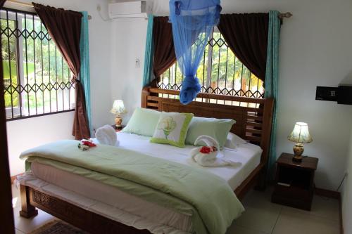 Кровать или кровати в номере Farida Apartments