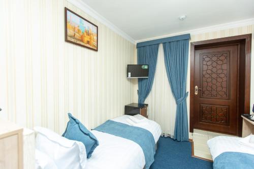 Ένα ή περισσότερα κρεβάτια σε δωμάτιο στο Mirzo Boutique Hotel