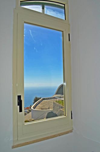 a window with a view of the ocean at Palazzo Mansi in Ravello