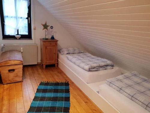 a room with two beds in a attic at Ferienhaus Färber in Bad Harzburg