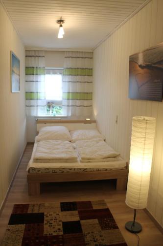 En eller flere senge i et værelse på Deichstube