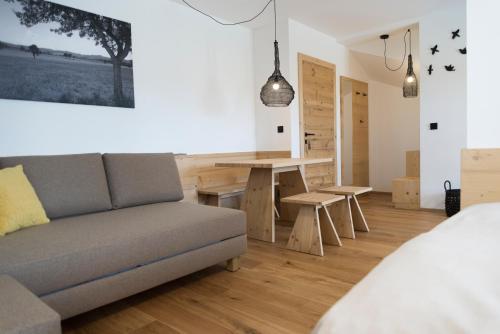 a living room with a couch and a table at Ölerhof in Haag am Hausruck
