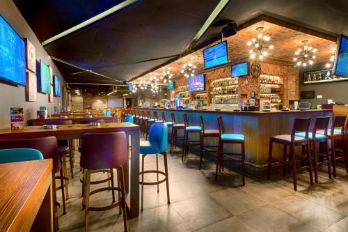 a bar with blue stools in a restaurant at Citymax Hotel Bur Dubai in Dubai