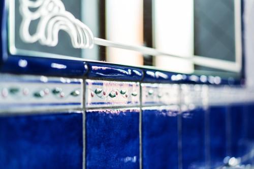 a white toothbrush sitting on top of a blue counter at Casale Ceppone in Vico Equense