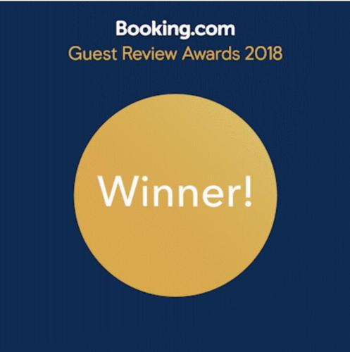 a yellow circle with the words guest review awards on it at Rumah Desa Homestay in Prambanan