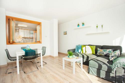 a living room with a couch and a table at Sitges Center & Beach Espalter in Sitges