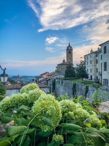 a view of a city with a clock tower at Hotel Villa Beccaris in Monforte dʼAlba