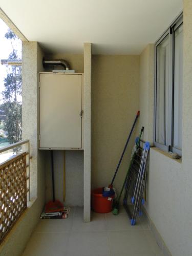 a room with a balcony with a door and a window at COSTA ALGARROBO in Algarrobo