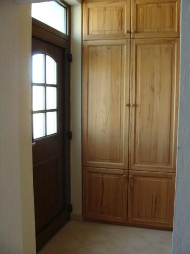 an empty room with a door and a window at Ferienwohnung Zossen in Zossen