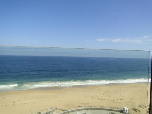 a view of the ocean from a beach at Condominio Arena Maris in Algarrobo