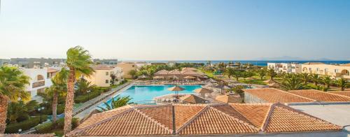 an aerial view of a resort with a swimming pool at Akti Beach Club in Kardamaina