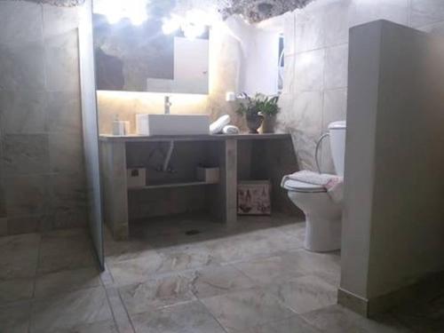 a bathroom with a sink and a toilet at Studio Rafaela in Matala