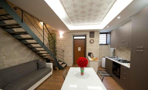 a living room with a couch and a table at Casa Aruci Sweet Home in Scicli