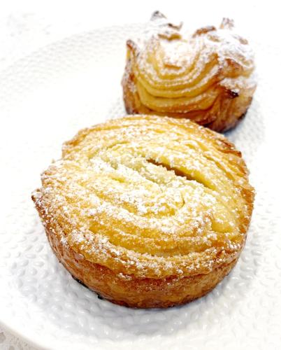 two pastries on a white plate on a table at Otter's Pond Bed and Breakfast in Eastsound