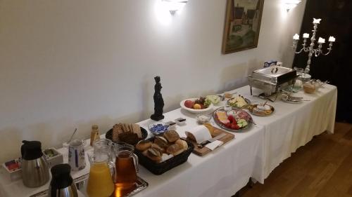 a table with a buffet of food on it at Gørdinglund Herregård Bed & Breakfast in Gørding