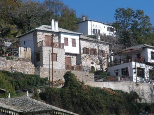 a house on the side of a hill at Seirios in Vizitsa