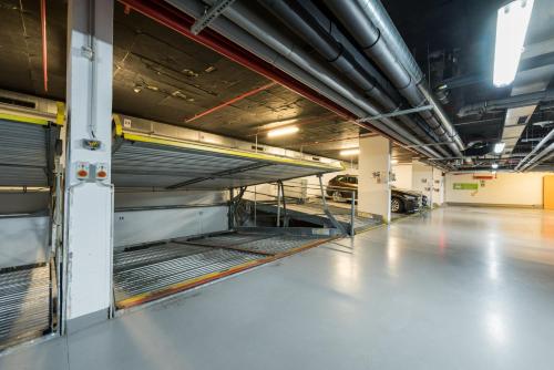 a large room with empty racks in a building at Lindner Hotel Prague Castle, part of JdV by Hyatt in Prague