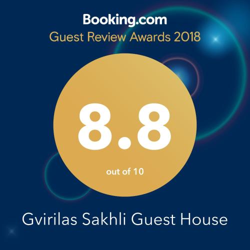 a flyer for a guest review awards with a yellow circle at Gvirilas Sakhli Guest House in Khashuri