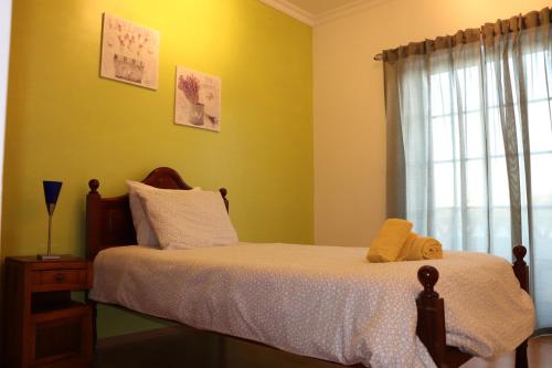 Кровать или кровати в номере Cantinho da Cacilda