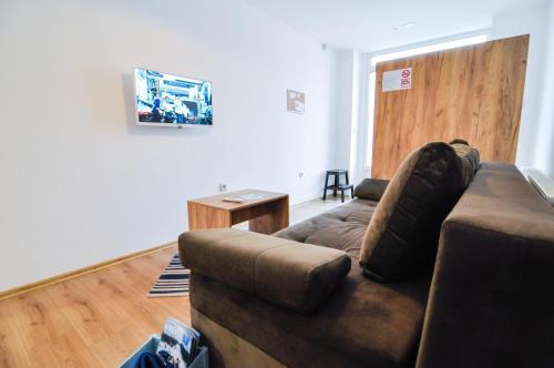 a living room with a couch and a table at Torus Apartments in Sarajevo