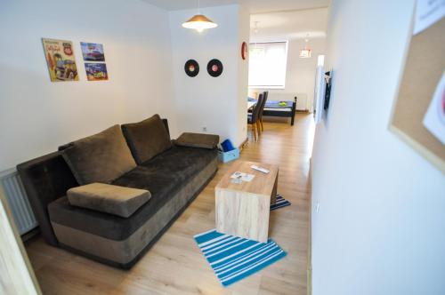 a living room with a couch and a coffee table at Torus Apartments in Sarajevo