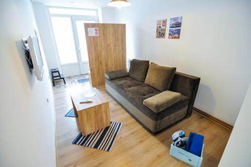 a living room with a couch and a coffee table at Torus Apartments in Sarajevo