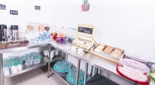 a counter in a store filled with lots of food at Playa Hotel - Cavancha in Iquique
