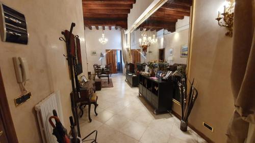 a living room with a hallway with a room with at Residenza Ca' Brighella in Venice