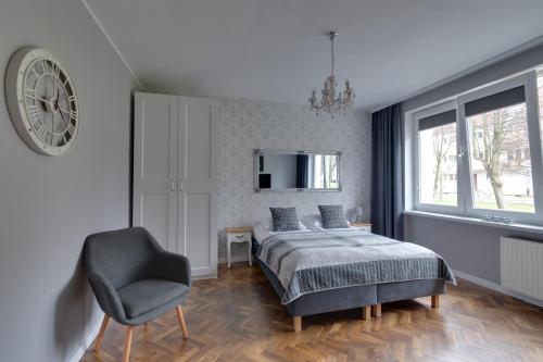 Posteľ alebo postele v izbe v ubytovaní Apartamenty Old Town Mniszki
