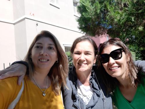 three women are standing next to each other at La Providencia in Yerba Buena
