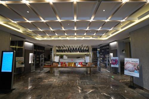 De lobby of receptie bij Hangzhou Cosy Park Hotel(Liangzhu)