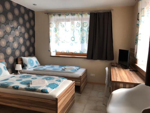 Postel nebo postele na pokoji v ubytování Hotel Harmonia