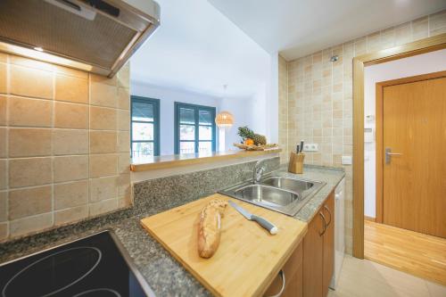 a kitchen with a sink and a counter top at Bravissimo Sant Pau in Girona