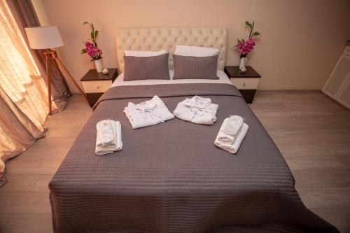 Postel nebo postele na pokoji v ubytování Olympic Batumi