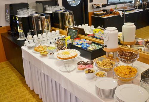 a table with a buffet of food on it at Hotel Rajka in Valašské Meziříčí