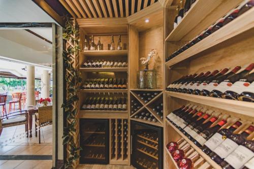 a wine cellar with a bunch of wine bottles at Aanari Hotel & Spa- Mauritius in Flic-en-Flac