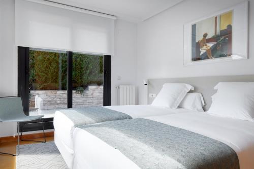 Voodi või voodid majutusasutuse Peine del Viento by FeelFree Rentals toas