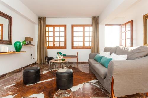 a living room with a couch and a table at BENNÁSSAR 2 in Felanitx