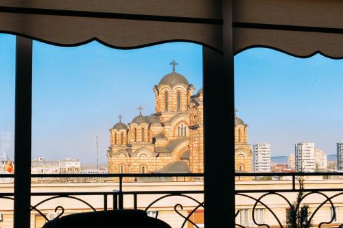 a view of a church from a window at President Lux in Belgrade