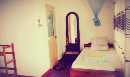 Postel nebo postele na pokoji v ubytování Deneth Homestay