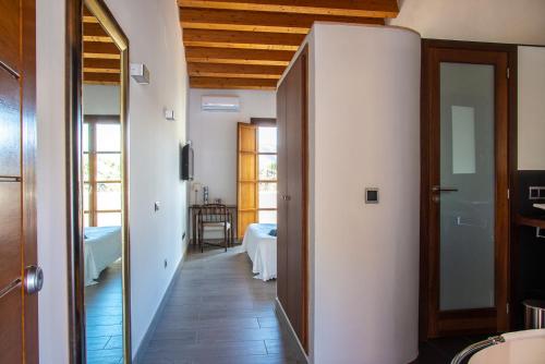 a hallway with a door leading to a room at Castell de la Solana in Alcalalí