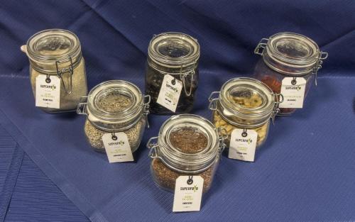 a bunch of jars of food on a table at Twelve Hotel in Moncalieri