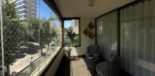 a balcony with a view of a city from a building at Departamento en Viña del Mar in Viña del Mar