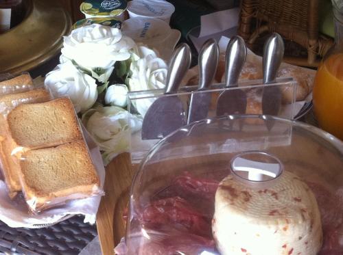 a table with a bowl of food with bread and sandwiches at Casa tipica siciliana patronale home BedandBreakfast TreMetriSoprailCielo Camere con vista, colazione interna in terrazzo panoramico in Caltagirone