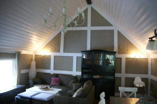a living room with a couch and a table at Eifelhoeve in Benenberg in Hellenthal