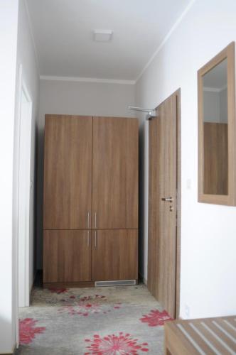 a room with two wooden cabinets in a bedroom at Hotel Prague Star in Prague